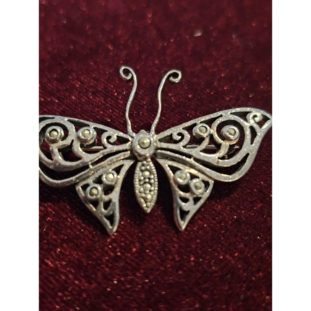 sterling butterfly pin. Marked 925 and hallmark CFT. About 1.5‎ brouch